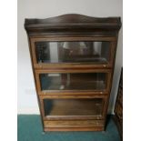 A MAHOGANY AND GLAZED DOOR CABINET of rectangular form the shaped moulded top with moulded three