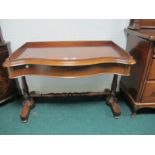 A GOOD VICTORIAN MAHOGANY SIDE TABLE of serpentine outline the shaped moulded top with moulded
