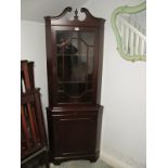 A MAHOGANY CORNER CABINET with astragal glazed door above a panel door on bracket feet 197cm (h) x