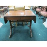 A GEORGIAN STYLE MAHOGANY SOFA TABLE the rectangular hinged top with reeded edge above two frieze