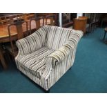 A PAIR OF UPHOLSTERED EASY CHAIRS each with a rectangular back and roll over arms and loose cushion