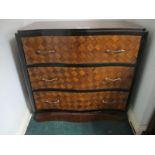 A CONTINENTAL PARQUETRY CHEST of serpentine outline the shaped moulded top above three long drawers