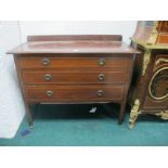 AN EDWARDIAN MAHOGANY CHEST with satinwood inlay the shaped moulded top above three long graduated