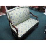 A CONTINENTAL MAHOGANY AND UPHOLSTERED SETTEE the rectangular upholstered back and seat with