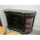 A VICTORIAN EBONISED CREDENZA of inverted breakfront outline the shaped moulded top above blind