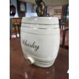 A WHITE GLAZED CHINA WHISKEY BARREL converted to a table lamp 67cm high