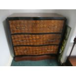 A CONTINENTAL PARQUETRY CHEST of serpentine outline the shaped moulded top above three long drawers