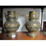 A PAIR OF ORIENTAL BRASS AND ENAMEL VASES each of baluster form decorated with  wine and turquoise