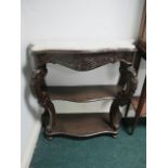 A CONTINENTAL MAHOGANY SIDE TABLE of serpentine outline surmounted with white vein marble top above