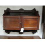 AN EDWARDIAN MAHOGANY WALL MOUNTED CABINET of rectangular form the super structure with moulded