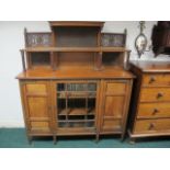 AN ARTS AND CRAFT MAHOGANY SIDE CABINET the super structure with moulded shelves and pierced