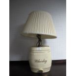 A WHITE GLAZED CHINA WHISKEY BARREL converted to a table lamp 67cm high