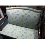 A CONTINENTAL MAHOGANY AND UPHOLSTERED SETTEE the rectangular upholstered back and seat with