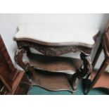 A CONTINENTAL MAHOGANY SIDE TABLE of serpentine outline surmounted with white vein marble top above