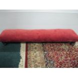 A VICTORIAN MAHOGANY AND UPHOLSTERED FOOTSTOOL the rectangular upholstered seat on bun feet