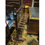 A VERY FINE VICTORIAN MAHOGANY BOOT RACK raised on baluster uprights and platform base with bun