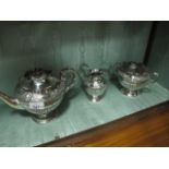 A THREE PIECE VICTORIAN EMBOSSED PLATED TEA SET