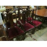 A FINE SET OF SIX QUEEN ANNE STYLE MAHOGANY DINING CHAIRS including an elbow chair each with a