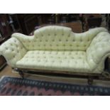 A VICTORIAN MAHOGANY UPHOLSTERED SETTEE the serpentine button upholstered back and seat with scroll