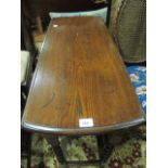 AN OAK DROP LEAF TABLE the oval hinged top raised on barley twist supports joined by cross