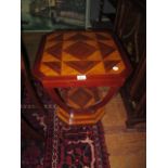 AN ART DECO STYLE OCCASIONAL TABLE the rectangular top with canted angles raised on a curved