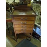 AN EDWARDIAN MAHOGANY AND SATINWOOD INLAID MUSIC CABINET the rectangular top with moulded gallery