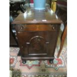 A MAHOGANY SIDE CABINET the rectangular top above a frieze drawer cupboard  with copper lined on