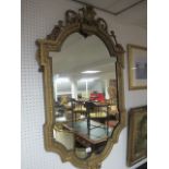 A GILT FRAME MIRROR 19th Century the shaped plate within an egg and dart moulded frame with