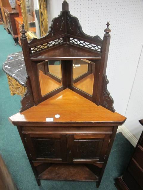 AN EDWARDIAN MAHOGANY CORNER CABINET the super structure with bevelled glass mirrors above a plain