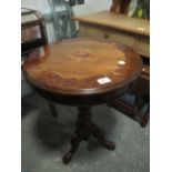 A WALNUT INLAID OCCASIONAL TABLE the circular moulded top above a baluster column on tripod support