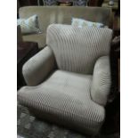 A GOOD THREE PIECE SUITE comprising of a settee with beige upholstery the rectangular back with