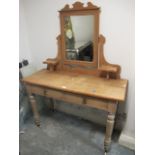 A VICTORIAN PINE DRESSING TABLE with frieze drawers on turned legs 148cm (h) x 113cm (w) x 44cm (d)