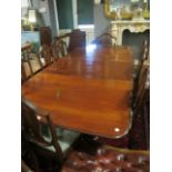 A FINE NINE PIECE MAHOGANY DINING SUITE comprising eight hepplewhite style chairs each with a