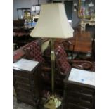 A BRASS FLOOR STANDARD LAMP the reeded column with Corinthian capital on square stepped base with