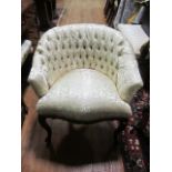 A CONTINENTAL MAHOGANY AND UPHOLSTERED TUB SHAPED BEDROOM CHAIR with deep button upholstered back