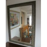 A COMPOSITION GILT FRAME MIRROR the rectangular bevelled plate within a moulded frame 100cm (h) x