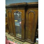 A VERY FINE VICTORIAN MAHOGANY THREE DOOR WARDROBE the moulded cornice above a central mirrored