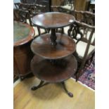 A GEORGIAN MAHOGANY THREE TIER DUMB WAITER each circular dish raised on a spiral twist column and