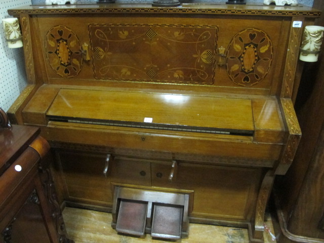 AN OAK AND PARQUETRY ORGAN now converted to a cocktail cabinet