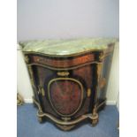 A CONTINENTAL EBONISED RED BOULLE AND BRASS INLAID SIDE CABINET of demi-lune outline surmounted