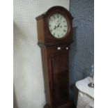 A VICTORIAN MAHOGANY LONG CASE CLOCK the rectangular arched hood with painted dial and Roman