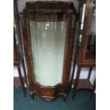 A GOOD FRENCH KINGWOOD GILT BRASS MOUNTED DISPLAY CABINET of bombe outline the stepped pediment