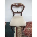 A PAIR OF VICTORIAN STYLE MAHOGANY DINING CHAIRS each with a carved splat and upholstered seat on