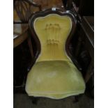 A VICTORIAN MAHOGANY LADIES CHAIR the serpentine top rail above a button upholstered back and seat