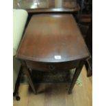 A MAHOGANY DROP LEAF TABLE with satinwood string inlay the oval hinged top with frieze drawer on