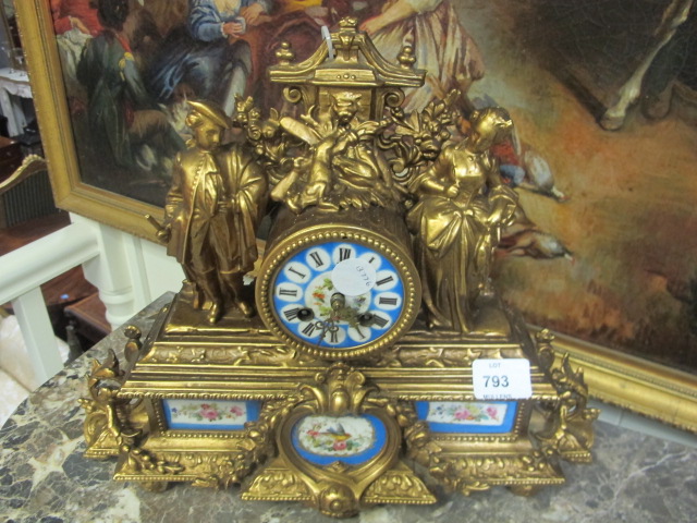 A FRENCH GILT METAL AND PORCELAIN CLOCK the rectangular case mounted with figures the painted dial