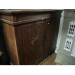 A LARGE ORIENTAL HARDWOOD CUPBOARD the moulded cornice above panelled doors on square tapering legs