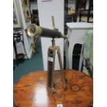 A BRASS AND LEATHER BOUND TABLE TOP TELESCOPE raised on telescopic tripod support telescope 43cm