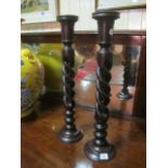 A PAIR OF CANDLESTICKS each with a pierced spiral twist column above a circular spreading foot