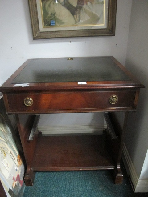 A MAHOGANY DESK the rectangular top with tooled leather inset above a frieze drawer with hinged